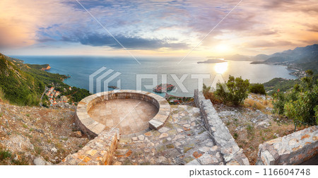Captivating sunset view of Adriatic coast and islet Sveti Stefan from church st. Sava viewpoint near Budwa 116604748