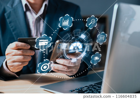 businessman use credit card with laptop and  hologram credit report score to plan in e-business, and buy or purchase produce payment online. The concept of finance and online shopping. 116604835