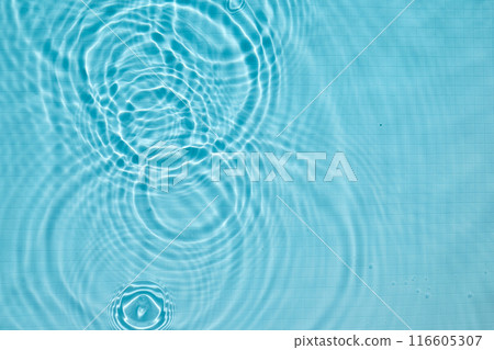 Calming ripples in a clear blue swimming pool 116605307