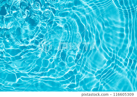 Rippling Water Surface. A calming image of rippling blue water with light reflections. 116605309