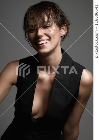 happy girl with wet short hair. young smiling woman in classic vest on naked body happy girl with wet short hair. young smiling woman in classic vest on naked body 116606043