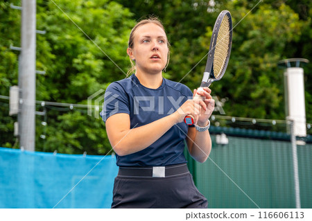 Professional female tennis player playing in tennis with racket and ball on outside court Professional female tennis player playing in tennis with racket and ball on outside court 116606113