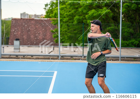 Professional male tennis player playing the tennis on outside court 116606115