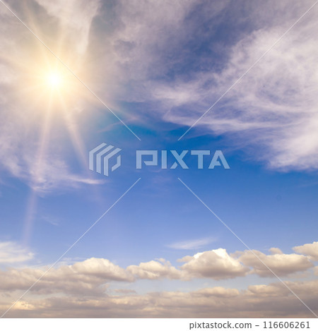 Blue sky with white clouds and sun. 116606261