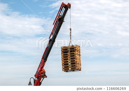 Crane loading palettes, Lanzarote, Spain Crane loading palettes, Lanzarote, Spain 116606269