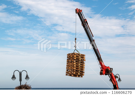 Crane loading palettes, Lanzarote, Spain 116606270
