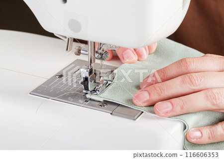 Sewing machine, stitching fabrics, needle in a round plan 116606353