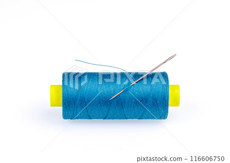 Macro skein of blue thread with a needle on a white background 116606750
