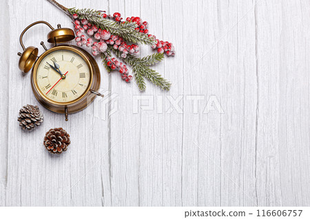 vintage christmas clock on wooden background 116606757
