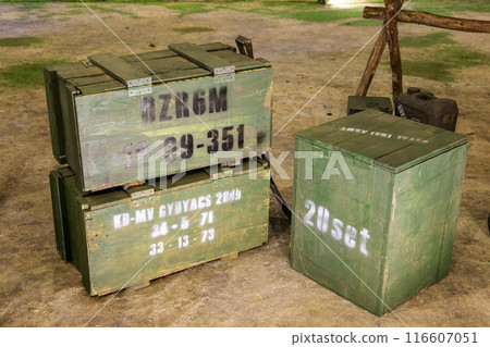 Wooden military crates for weapons and ammunition, Stacks of old military ammunition boxes. Wooden military crates for weapons and ammunition, Stacks of old military ammunition boxes. 116607051