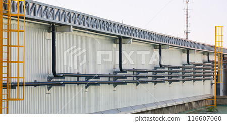 Orderly drainage pipes, pipe with label "RL" with direction for rain line to drain the water from building.  116607060