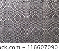 Handmade homespun fabric in an old rustic ethnic style. Traditional warm handmade texture effect. 116607090