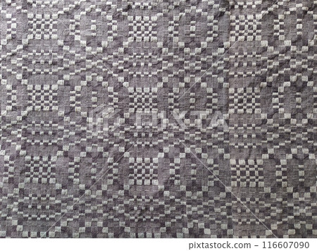 Handmade homespun fabric in an old rustic ethnic style. Traditional warm handmade texture effect. Handmade homespun fabric in an old rustic ethnic style. Traditional warm handmade texture effect. 116607090