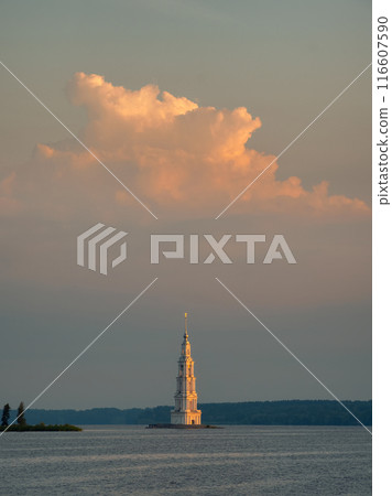 Stunning cloud over the bell tower on the island, minimalistic sunset view. Stunning cloud over the bell tower on the island, minimalistic sunset view. 116607590
