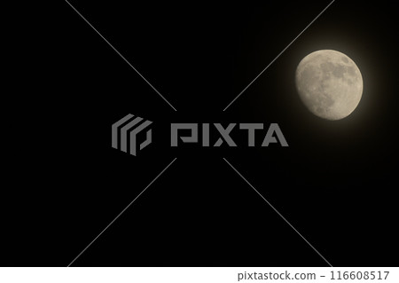 A thin veil-like cloud-covered May moon at lunar age 12.0 116608517