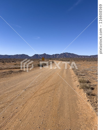 Mountains and dirt road in the Australian Outback Mountains and dirt road in the Australian Outback 116608569