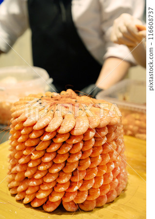 Healthy food. Fresh shrimps with ice on plate on light background top view Healthy food. Fresh shrimps with ice on plate on light background top view 116608737