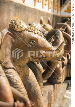 elephant heads as facade decoration onBuddhist temple in Sri Lanka 116609372