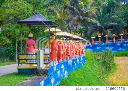 row of Buddhist monk statues in Dambulla 116609550