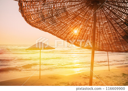 Beach Umbrella On Idyllic Tropical Sand Beach. Concept For Rest, Relaxation, Holidays, Spa, Resort. Wicker Beach Umbrella At Mediterranean Resort. Vacation Concept. Advertising Travel Company. Beach Umbrella On Idyllic Tropical Sand Beach. Concept For Rest, Relaxation, Holidays, Spa, Resort. Wicker Beach Umbrella At Mediterranean Resort. Vacation Concept. Advertising Travel Company. 116609900