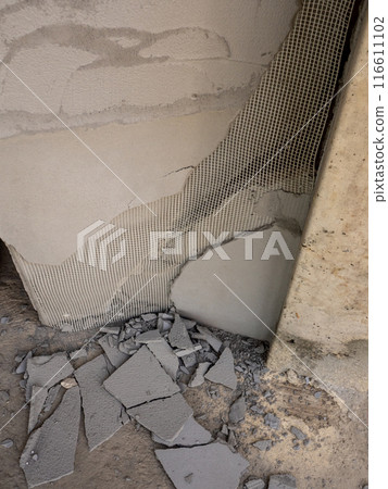 Concrete fragments and foam sheets from broken, damaged walls Concrete fragments and foam sheets from broken, damaged walls 116611102