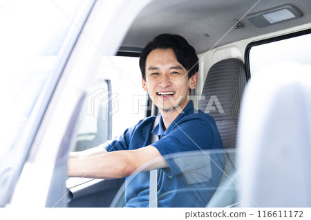Truck driver portrait looking at camera Truck driver portrait looking at camera 116611172