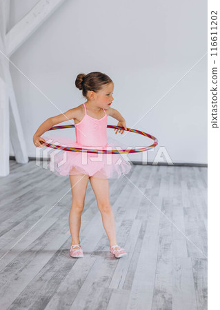 Baby ballet studio. Little ballerina with a coach in dance class. Ballet trainer for children Baby ballet studio. Little ballerina with a coach in dance class. Ballet trainer for children 116611202