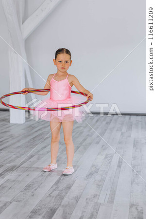Baby ballet studio. Little ballerina with a coach in dance class. Ballet trainer for children 116611209