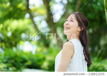 A woman relaxing in the park A woman relaxing in the park 116611233