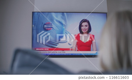 Big flat screen TV monitor with displayed news about elections 116611603