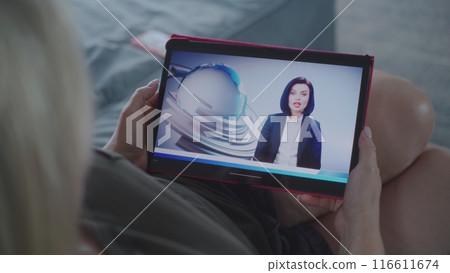 Tablet screen shows news broadcast about US elections with female newscaster Tablet screen shows news broadcast about US elections with female newscaster 116611674