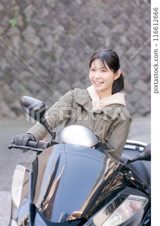  Woman riding a bike 116612666