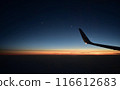 Sunset seen from an airplane window 116612683