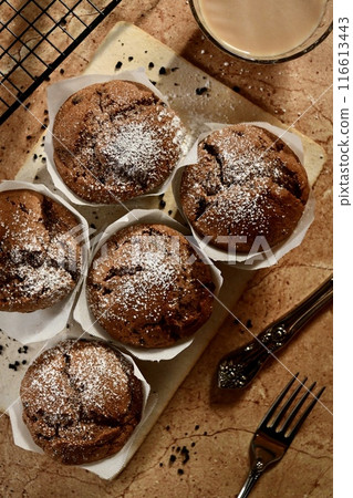 Chocolate muffins and milk tea lined up Chocolate muffins and milk tea lined up 116613443