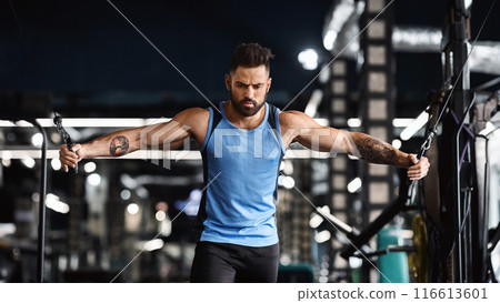 Handsome focused bodybuilder working out pushing up exercise in gym, sport motivation poster 116613601