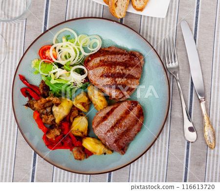 Roast beef with artichokes and tasty bell pepper. Delicious healthy lunch Roast beef with artichokes and tasty bell pepper. Delicious healthy lunch 116613720