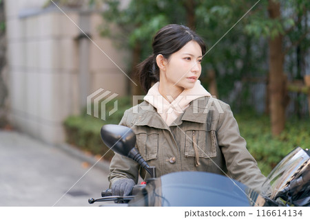  Woman riding a bike 116614134