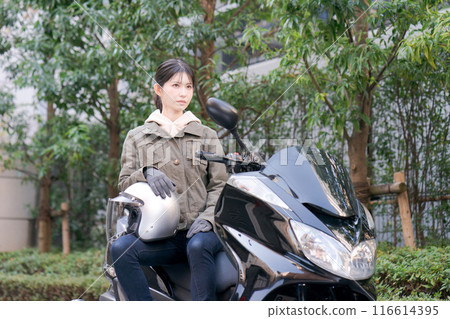 Woman riding a bike Woman riding a bike 116614395