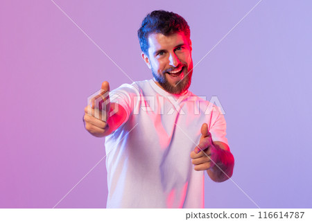 A man standing in a white shirt with a smile on his face, raising his thumb up in a positive gesture. A man standing in a white shirt with a smile on his face, raising his thumb up in a positive gesture. 116614787