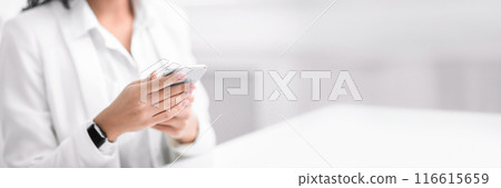 Social Media. Unrecognizable mexican woman chatting online using her smart phone, copy space, panorama, cropped shot 116615659