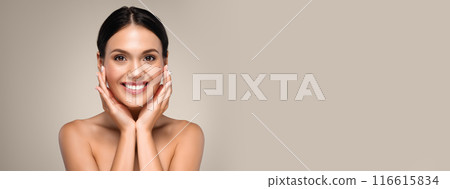 Cheerful young woman posing topless over grey studio background, touching her face and smiling, copy space Cheerful young woman posing topless over grey studio background, touching her face and smiling, copy space 116615834