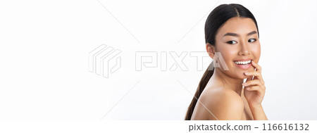 Portrait of attractive naked young asian lady posing on white studio background, cheerfully smiling at camera, copy space. Skin and body care for young women, healthy lifestyle concept 116616132
