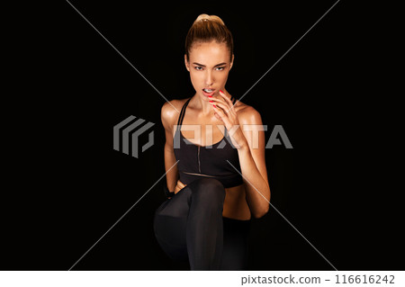 Determined Fit Woman Jogging In Place On Black Background. Studio Shot, Empty Space For Text 116616242