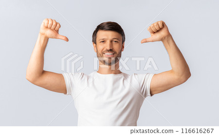 Self-Confidence Concept. Smiling Man Pointing With Thumbs At Himself Over White Studio Background. Isolated 116616267