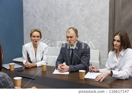 Business meeting in modern office. Business meeting in modern office. 116617147