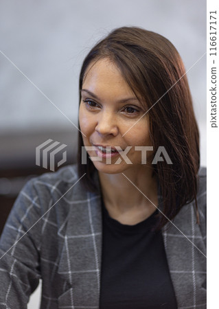 Female team leader at business meeting in office. 116617171