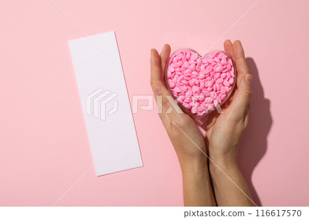 Wax granules for depilation laid out in the shape of a heart Wax granules for depilation laid out in the shape of a heart 116617570