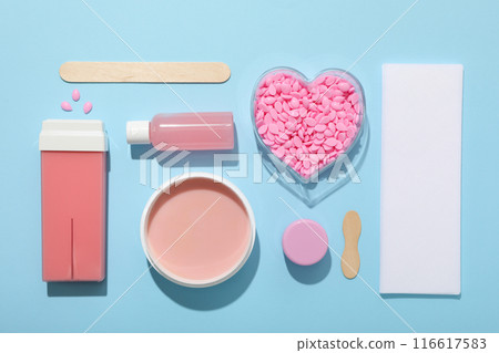 Accessories for waxing on a blue background 116617583