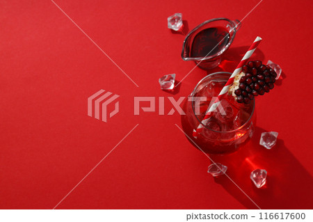 Cocktail with pomegranate juice and ice cubes Cocktail with pomegranate juice and ice cubes 116617600