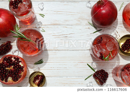 Red cocktail with fresh pomegranate on a white background 116617606